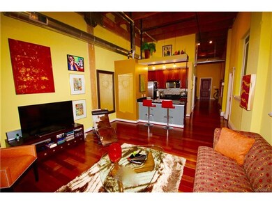 Large open living area featuring high 14' ceilings