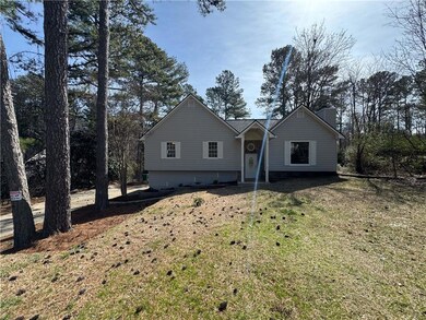 View of front of home featuring a chimney and a fr