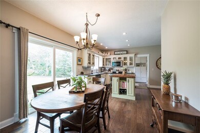 Dining leading between kitchen and great room