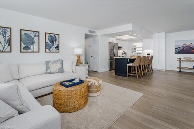 Kitchen with visible vents, a kitchen island, open