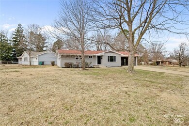 Large front yard on high ground. Home is set back