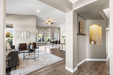 Living area with dark wood-style floors and recessed lighting