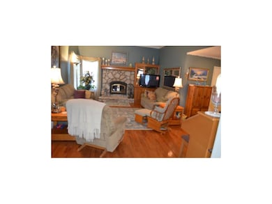 Family Room with a woodburning fireplace that heat