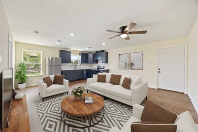 A contemporary open living room design with a wood