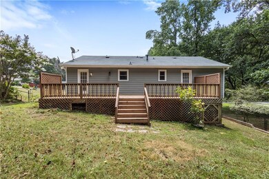 Back of house featuring a deck