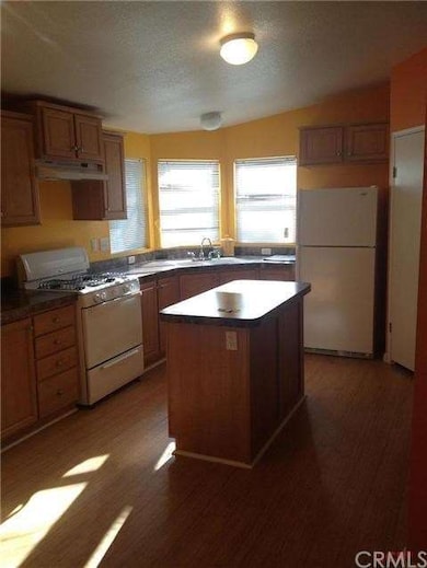 Kitchen has an island and full pantry.