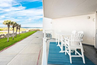 View of patio with a water view and fence