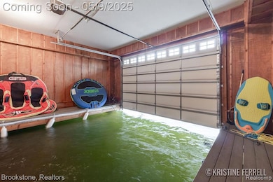 Private boat well opening to Crooked Lake