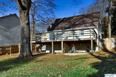 fenced in back yard with spacious deck