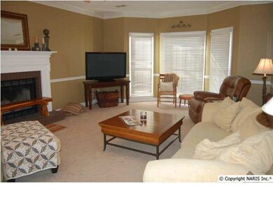 LIVING ROOM WITH BAY WINDOW IN FRONT CROWN AND CHAIRAIL TRIM