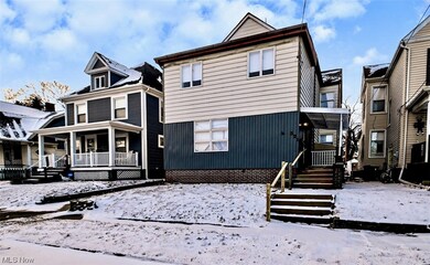 View of snow covered back of property