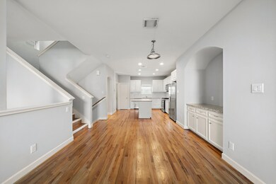Dining area is located between the kitchen and liv