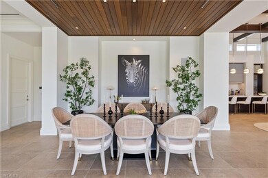 Dining space with wood ceiling and tile patterned flooring