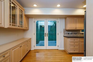 Hard Maple Built-In Buffet and Cabinetry.  Beautiful French Doors Open to the Backyard.