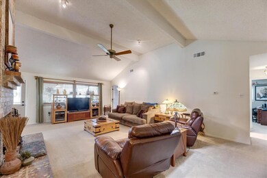 Grand sized living area complete with fireplace and new windows providing lots of light.