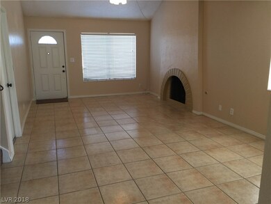 Living Room With Fireplace, Ceiling Fan, Tile Floo