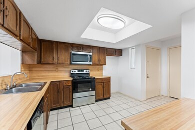 This kitchen features classic wooden cabinetry, an