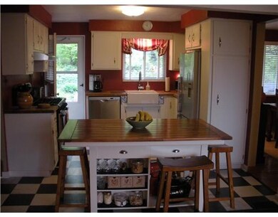 Kitchen. Kitchen has Island, Farm House Sink and B