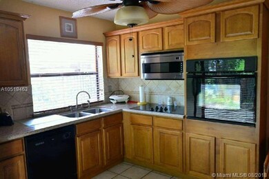 Updated kitchen, wood cabinets, stainless steel ap