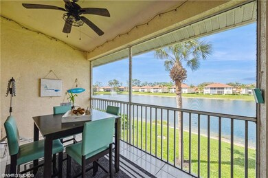 Sunroom with ceiling fan, a water view, and a weal