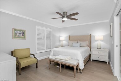Spacious living and dining room with wood flooring