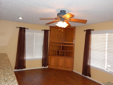 Unfurnished living room with baseboards, a texture
