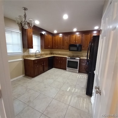 Large eat in Kitchen with stove, sink, dishwashing machine, with double door pantry and refrigerator