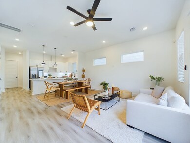 open concept living/dining/kitchen area on the fir