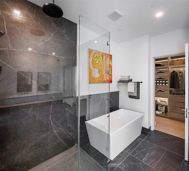 Primary retreat features a double vanity, separate