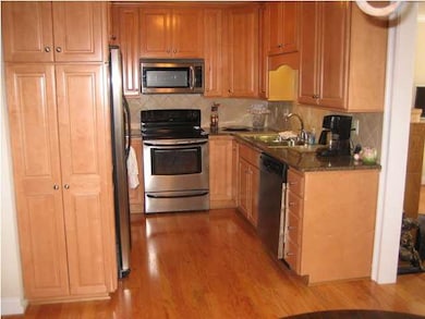 Kitchen Has Hardwood Floors, Tall Honey Colored Wo