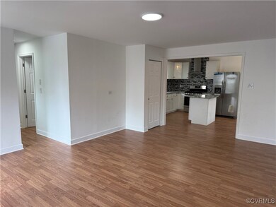 Kitchen with wood finished floors, stainless steel