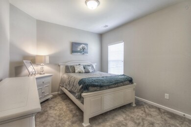 Guest bedroom has oversized closet.