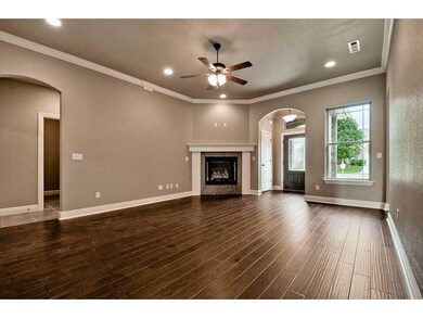 Exterior Front. Living Room - Arched doorways.
