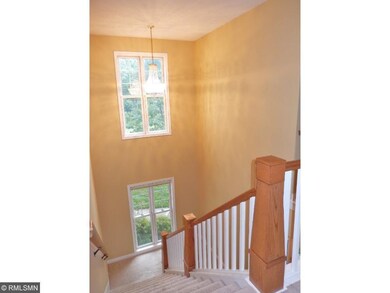 Beautiful staircase with floor to ceiling windows.