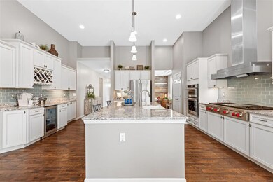 Granite counters and a multitude of cabinets with 