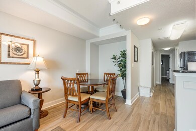 Dining space featuring light hardwood / wood-style