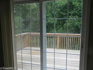 Patio/Deck. View from family room of deck and wooded back yard.