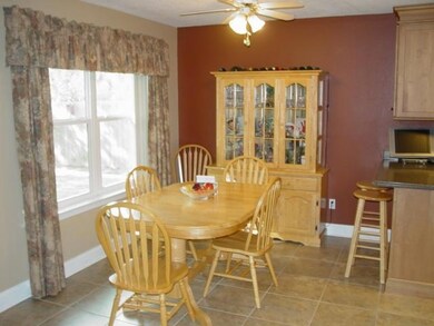 Dining area in kitchen that overlooks the back yard.