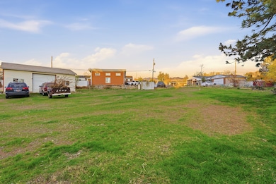 View of yard and exterior garage.