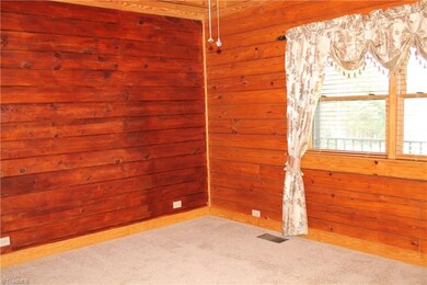 This is the master bedroom with carpet and nice wi