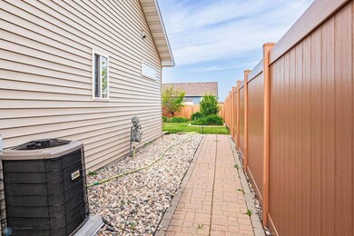 Paved walkway to backyard