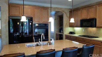 Stunning gourmet kitchen with granite island and b