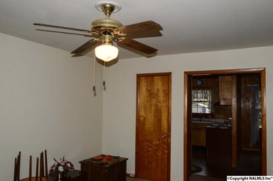 FROM FRONT OF LIVING ROOM TO KITCHEN AND DINING.