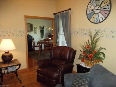 Hardwood floor flows from living room to dining ro