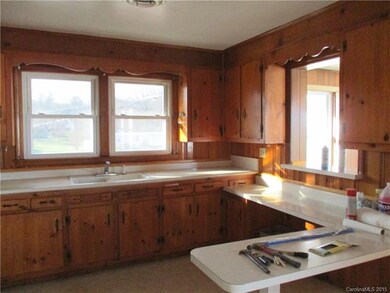 Kitchen looking into den pass through