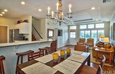 Open floor plan with views from the dining to livi