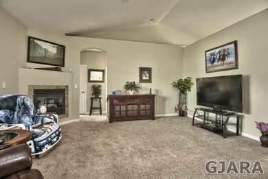 Vaulted ceilings and tall curved entryways give th