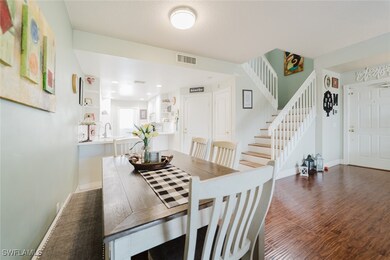Dining room featuring stairs, visible vents, wood