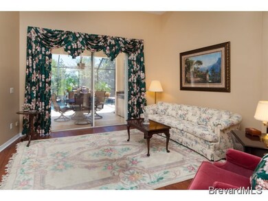 LIVING ROOM WITH POOL VIEW
