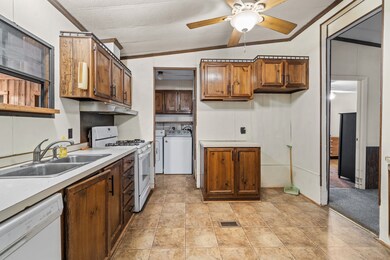 Kitchen area. Refrigerator doesn't fit in the designated space, it's too large.